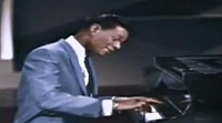 Nat 'King' Cole performing Let There Be Love